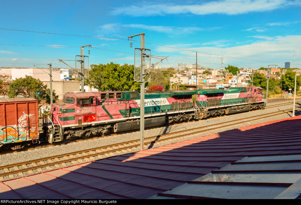 FXE AC4400 Locomotives leading a mixed freight train